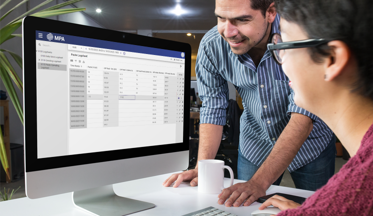 man and woman using computer